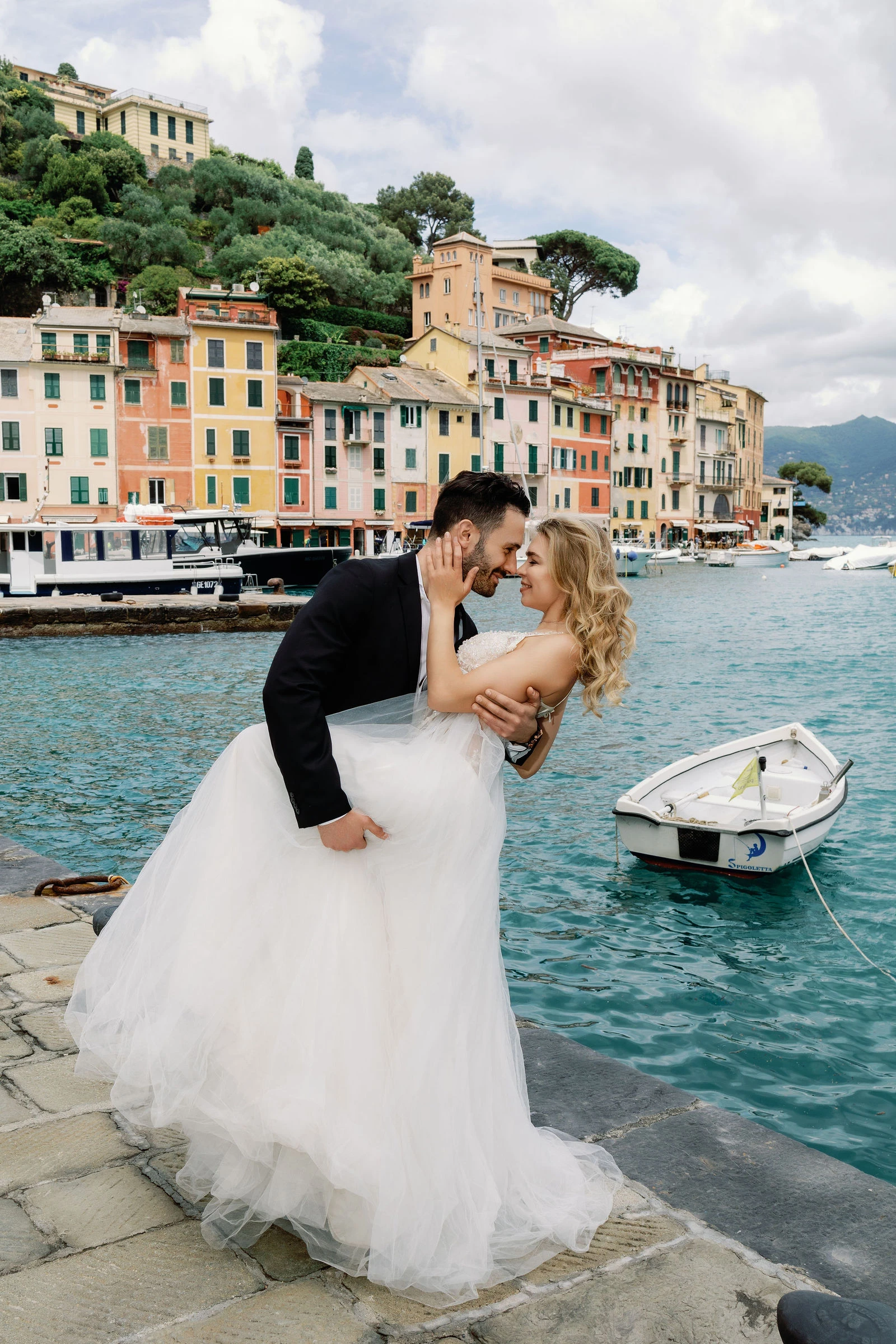 Groom dipping the bride on the Portofino harbour front