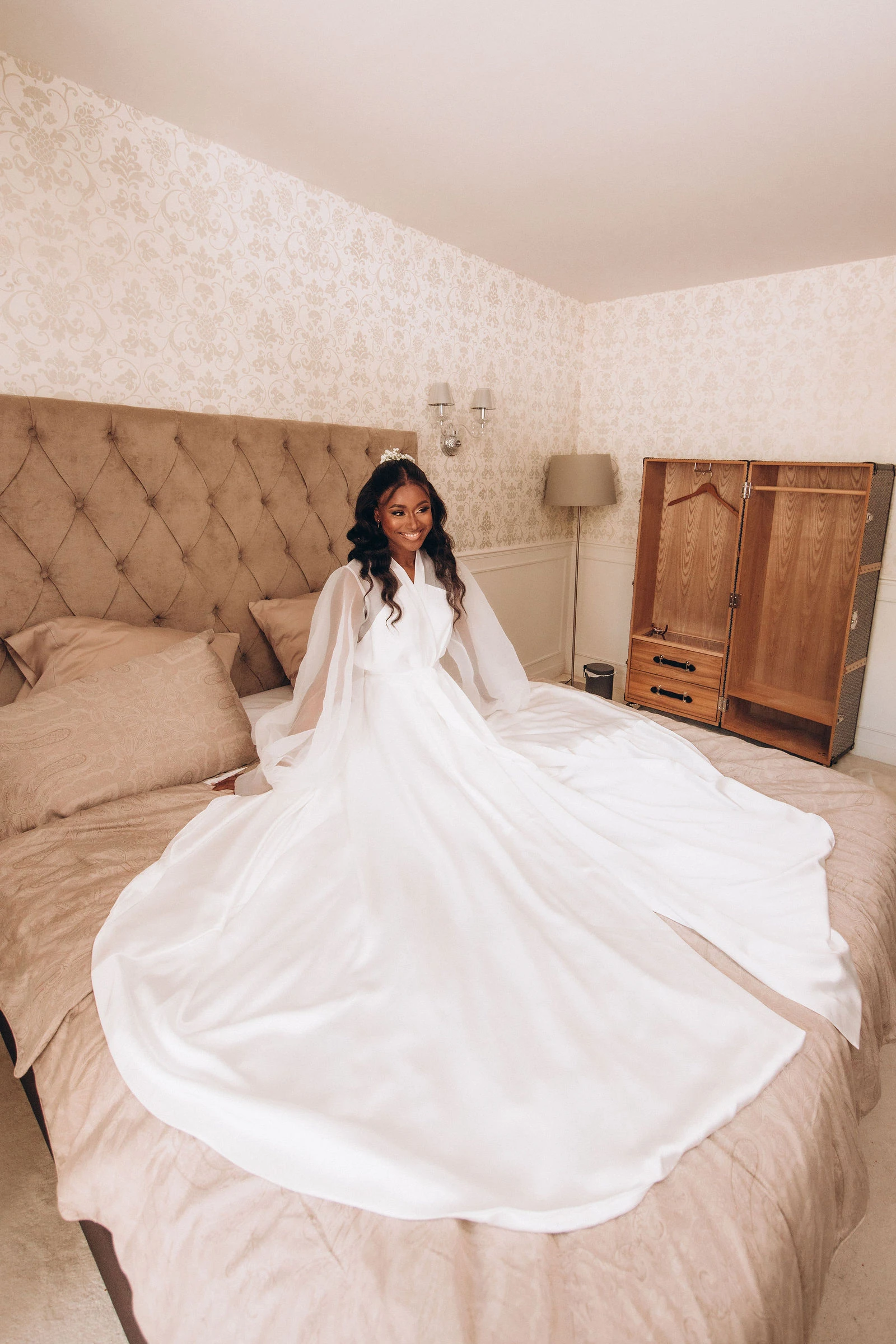 Wedding dress spread across the bed