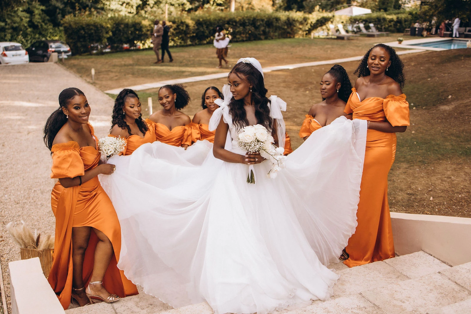Bride with her bridesmaids on the steps