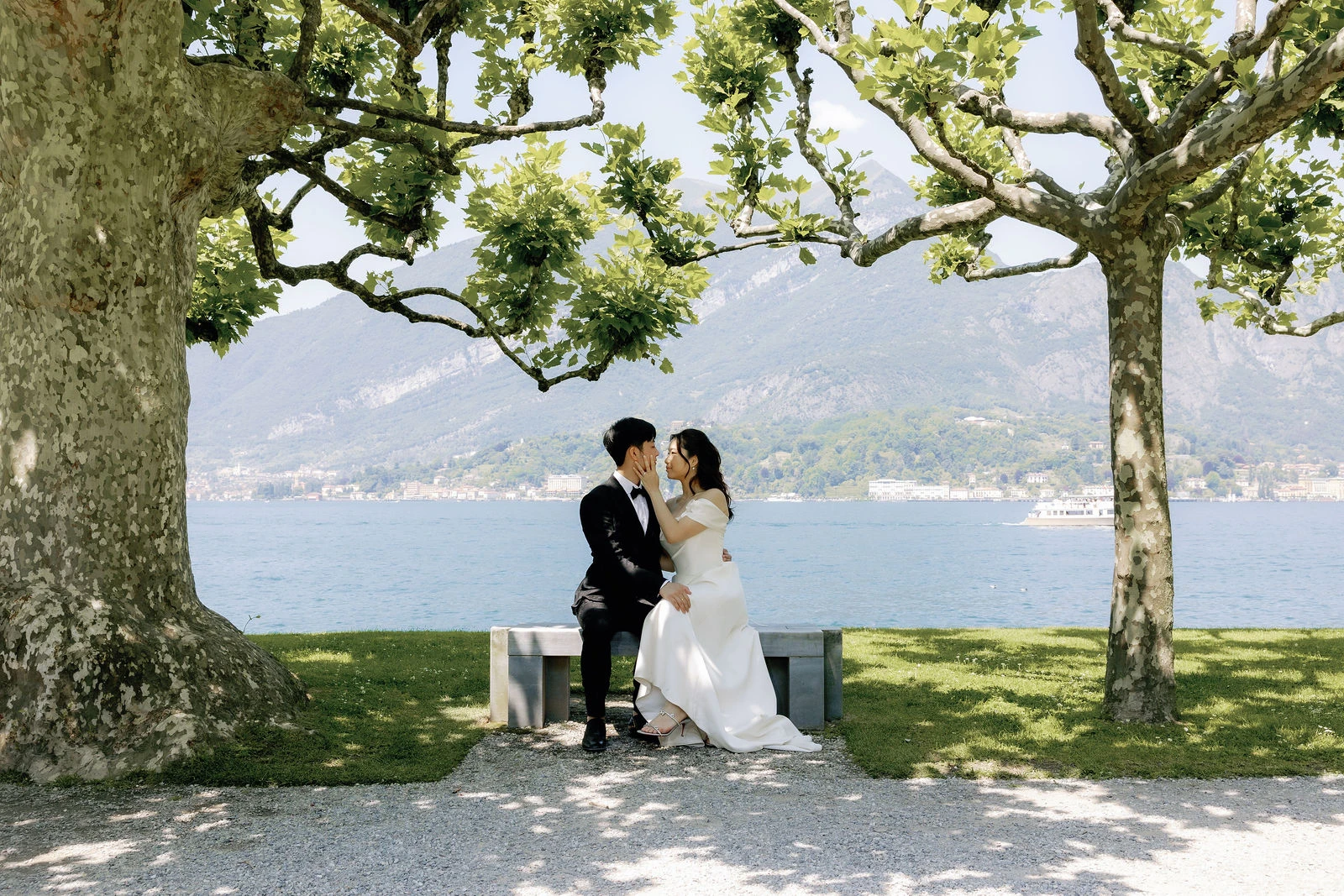 Couple under a plane tree by Lake Como
