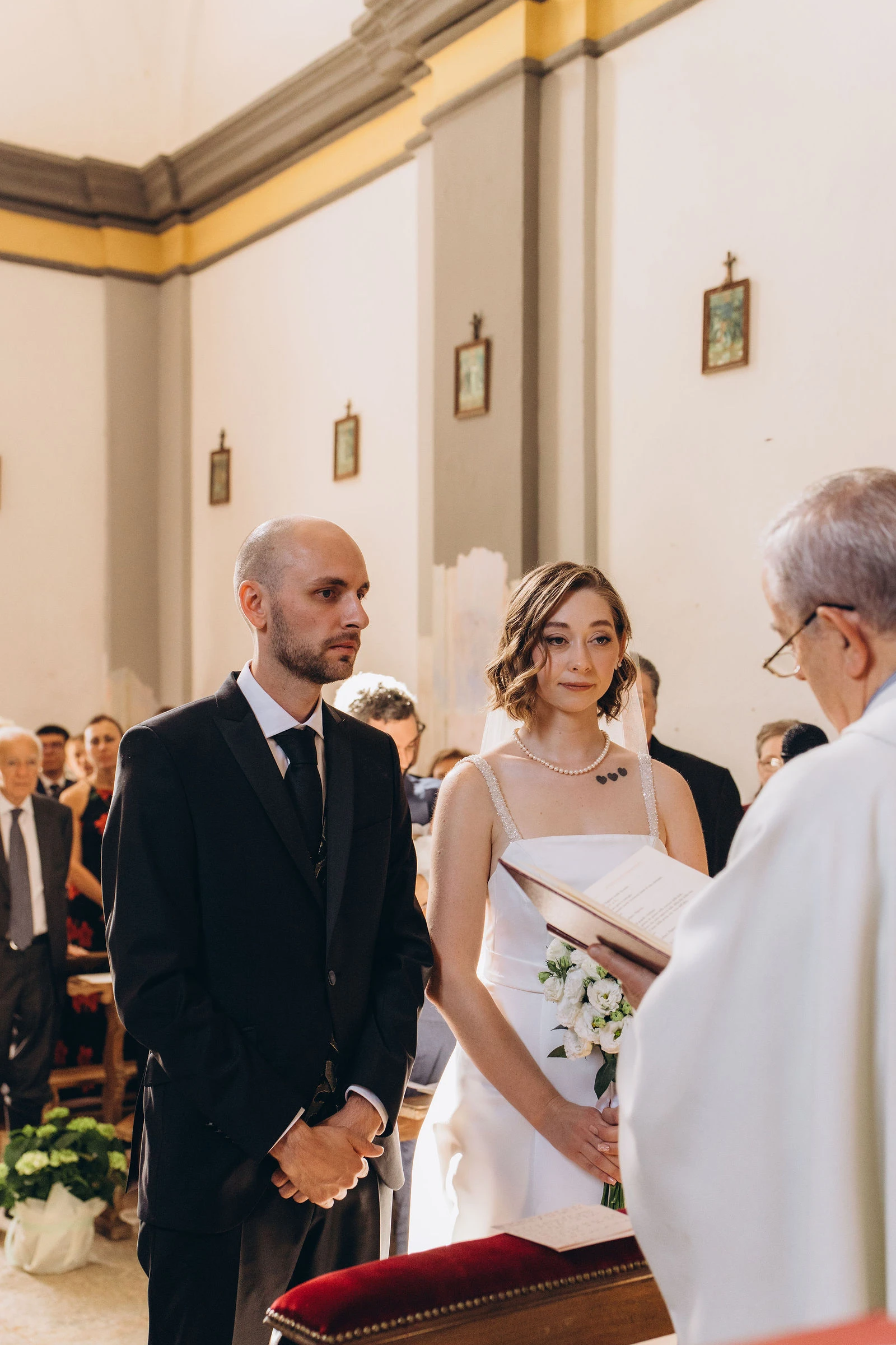 Vows in front of the priest in a countryside church