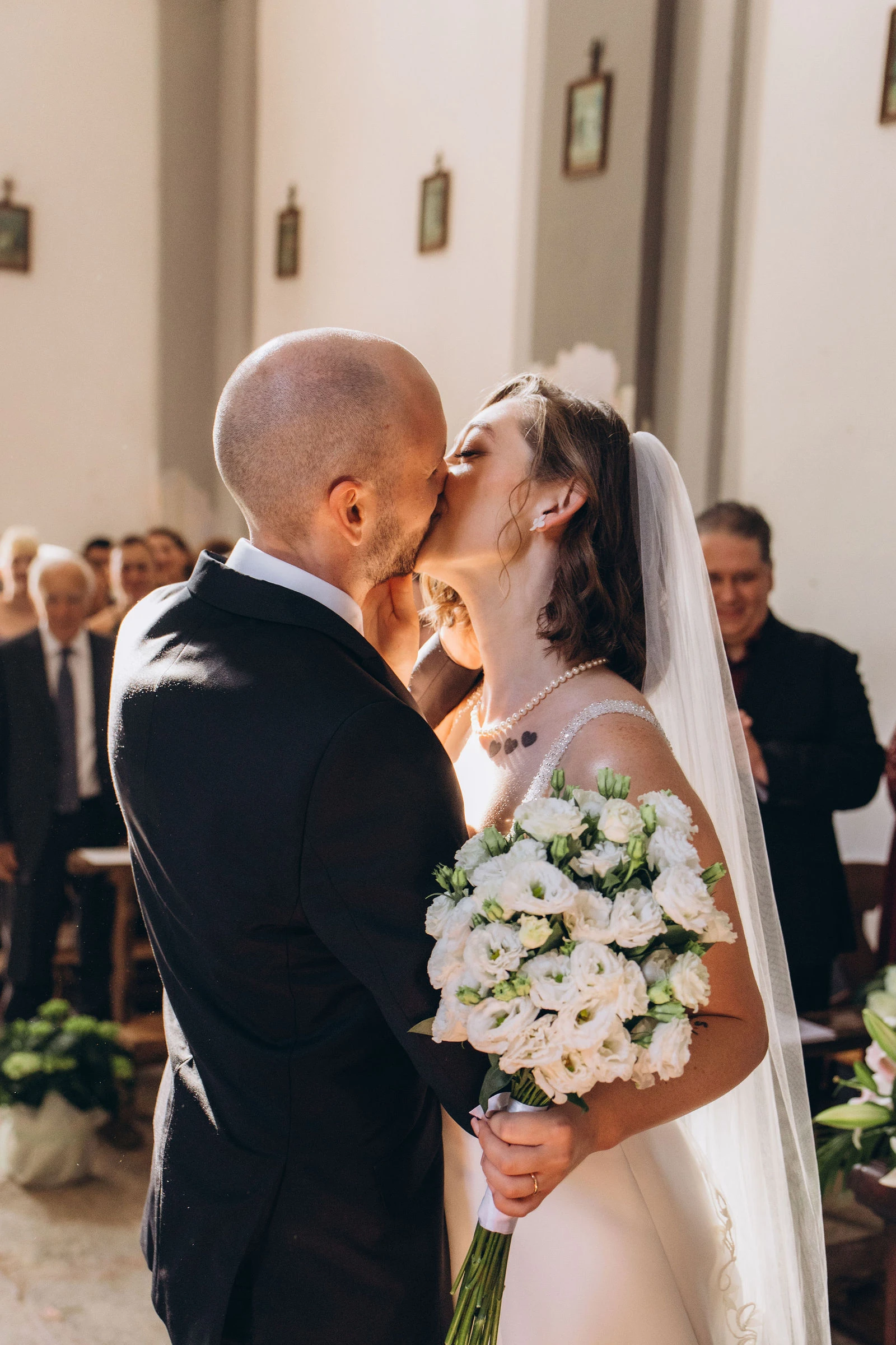 First kiss as husband and wife at the altar