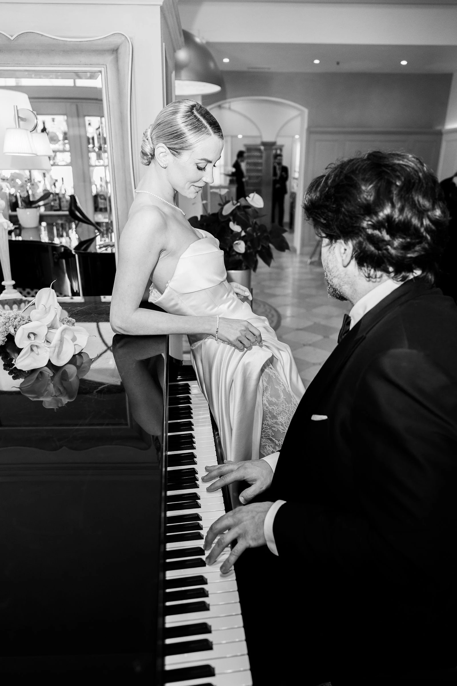 Black and white, the couple by the piano