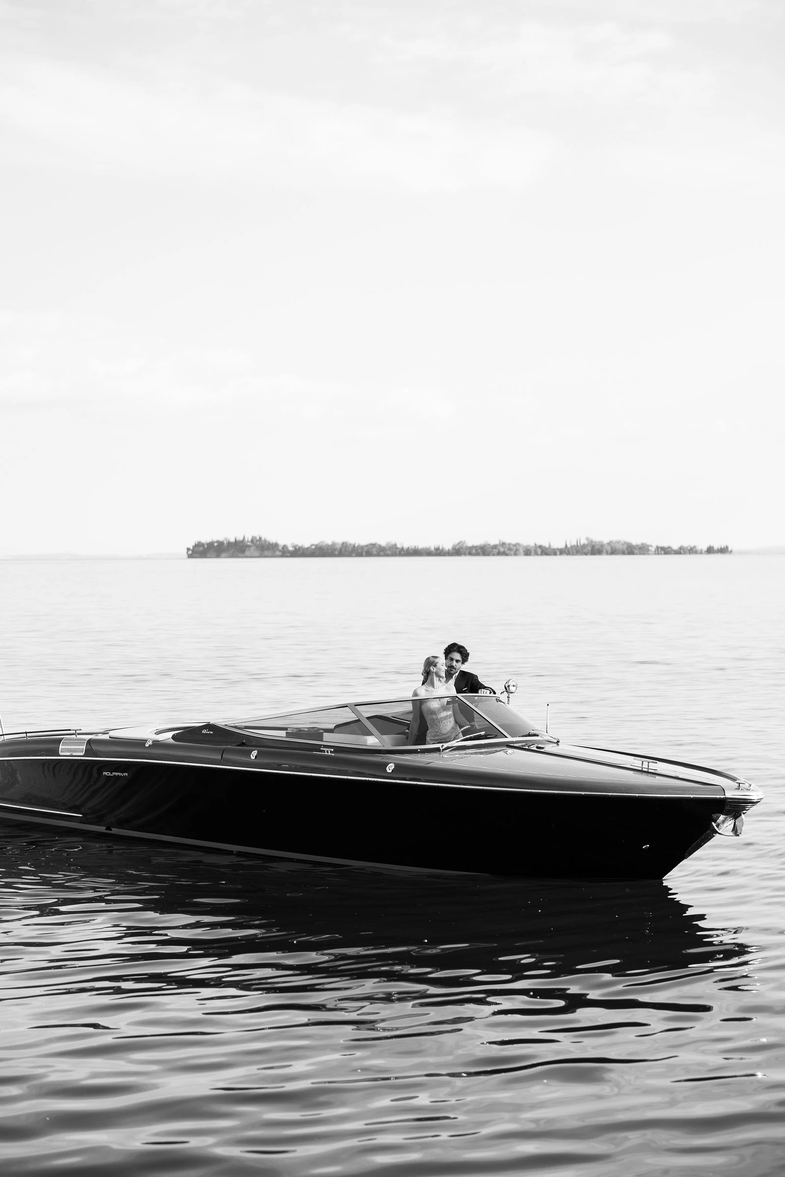 Riva boat on open water, Lake Garda
