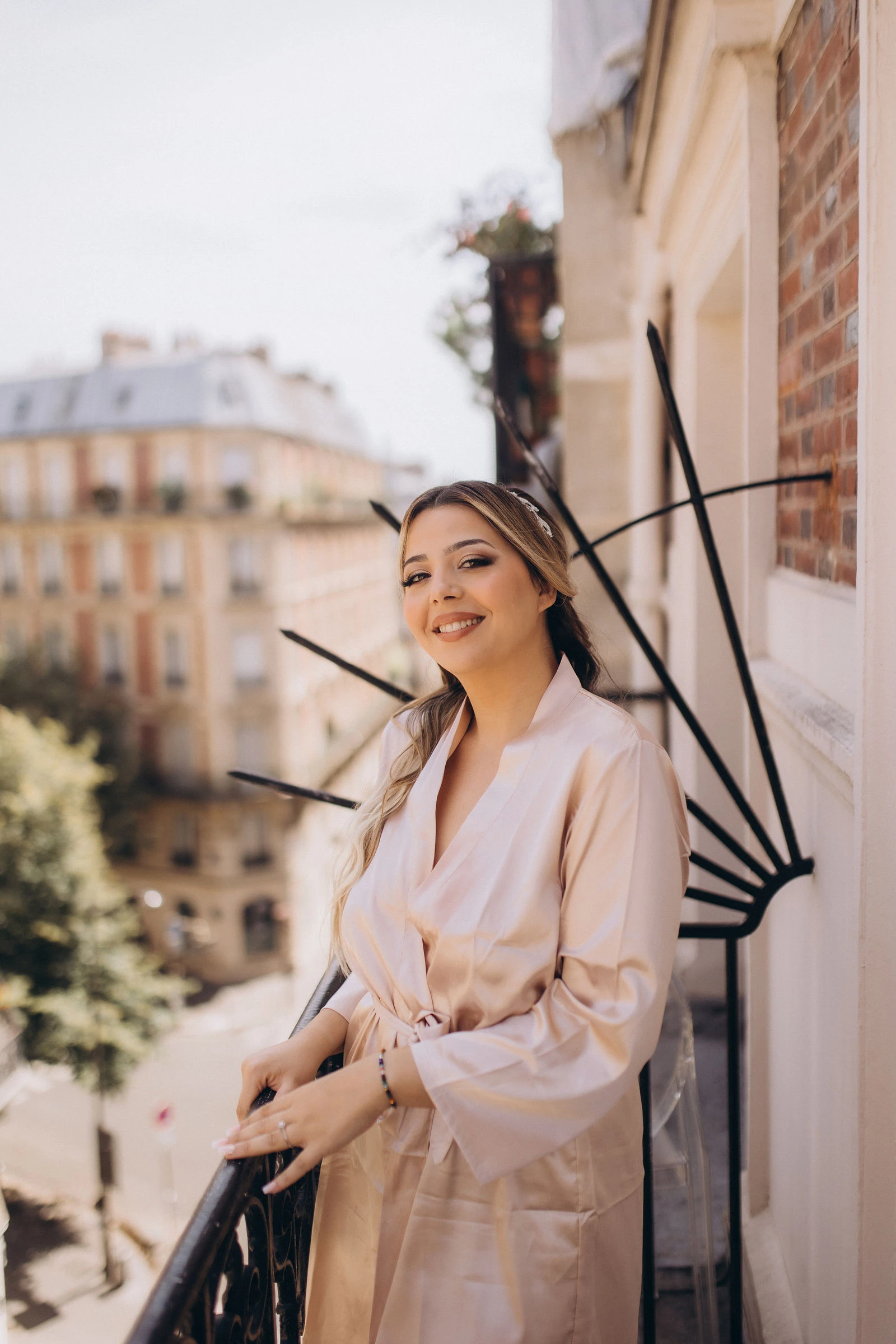 Bride on a Paris balcony in the morning