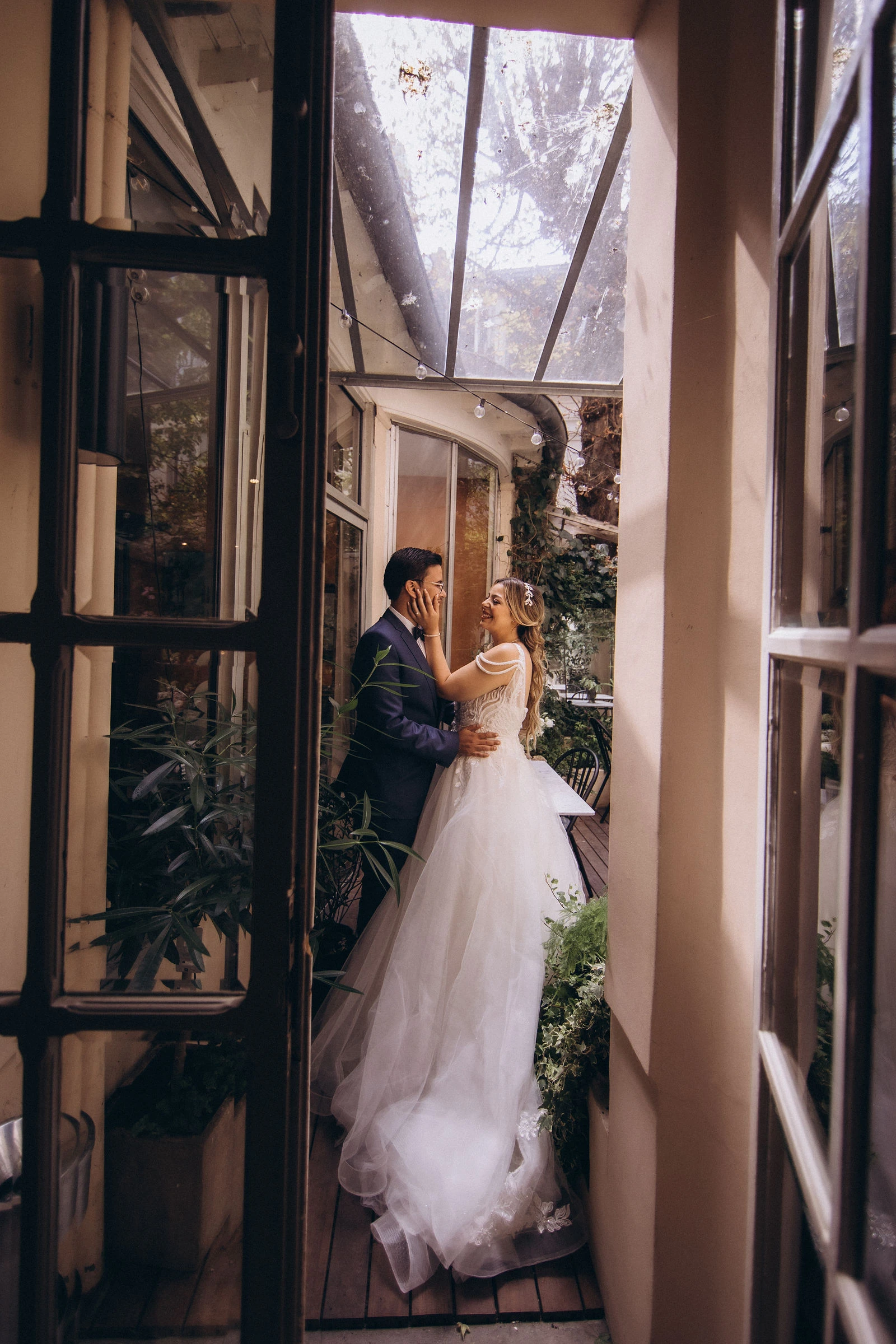 Couple by a tall window
