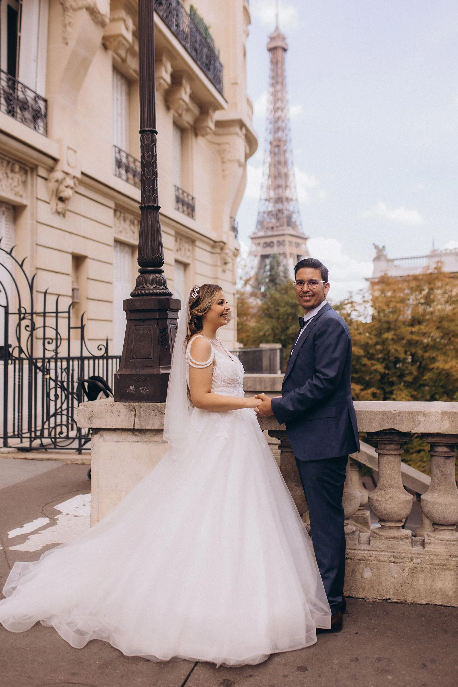 Couple by a street lamp, Eiffel Tower behind