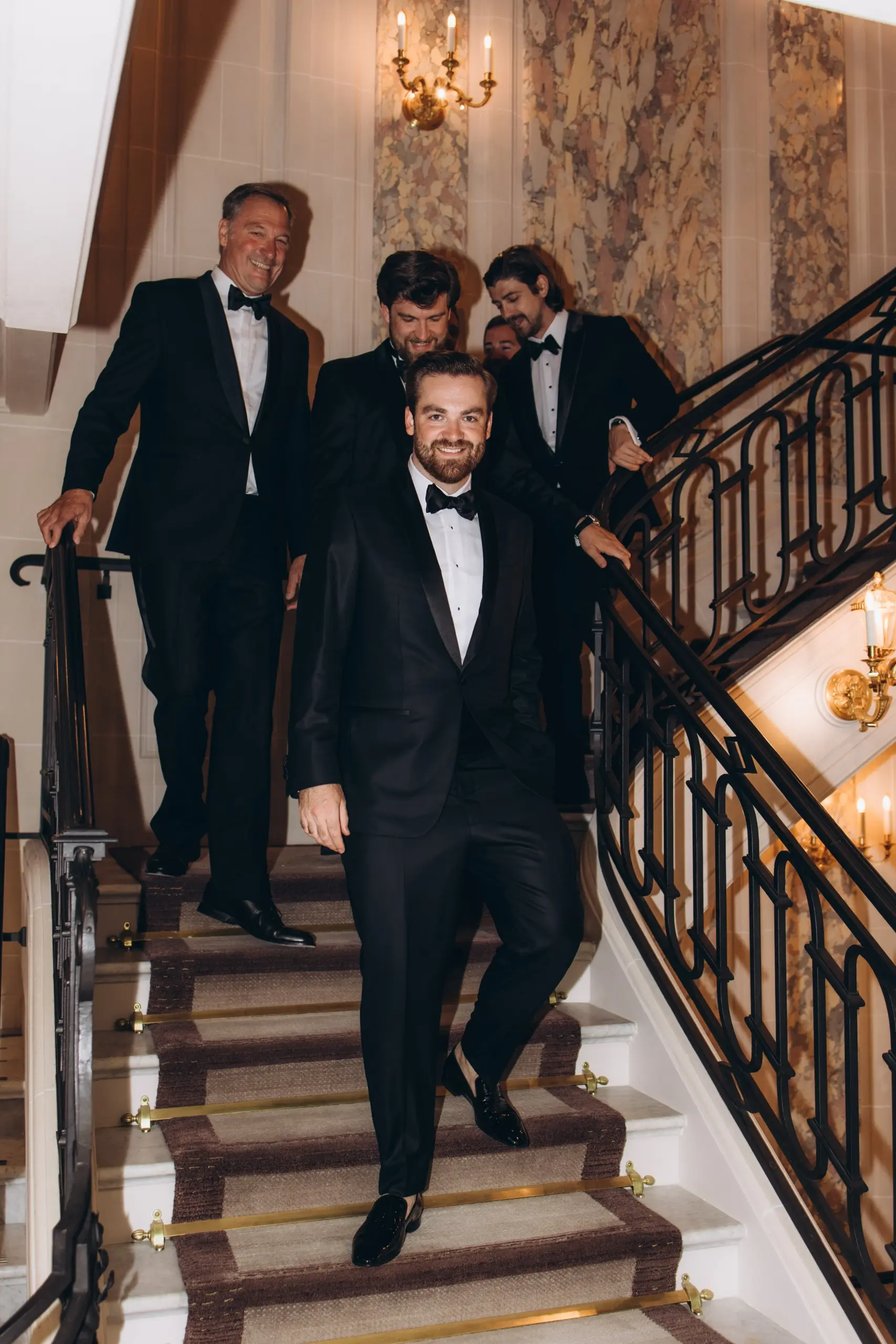 Groomsmen on the hotel staircase