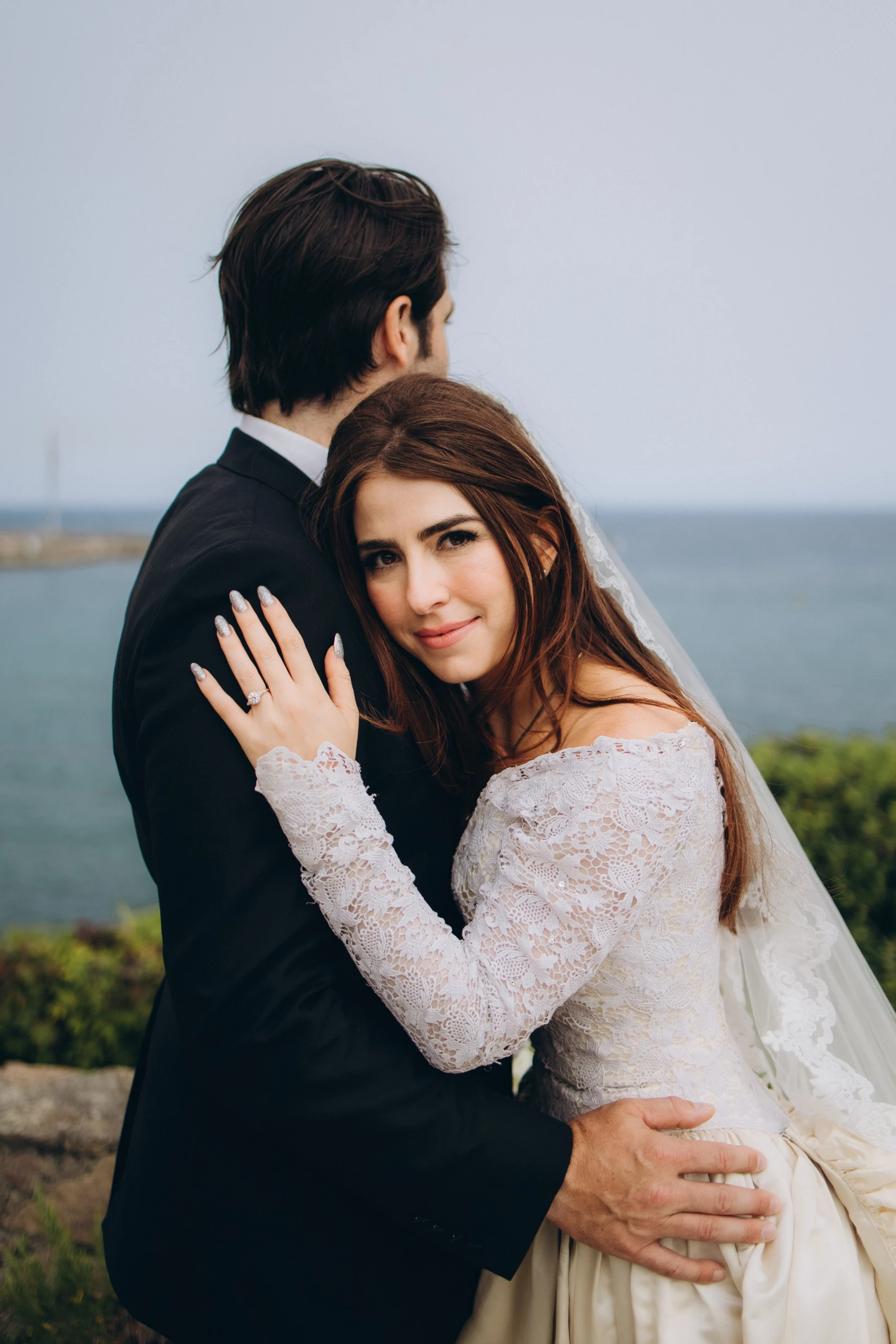 Couple by the sea after the first look