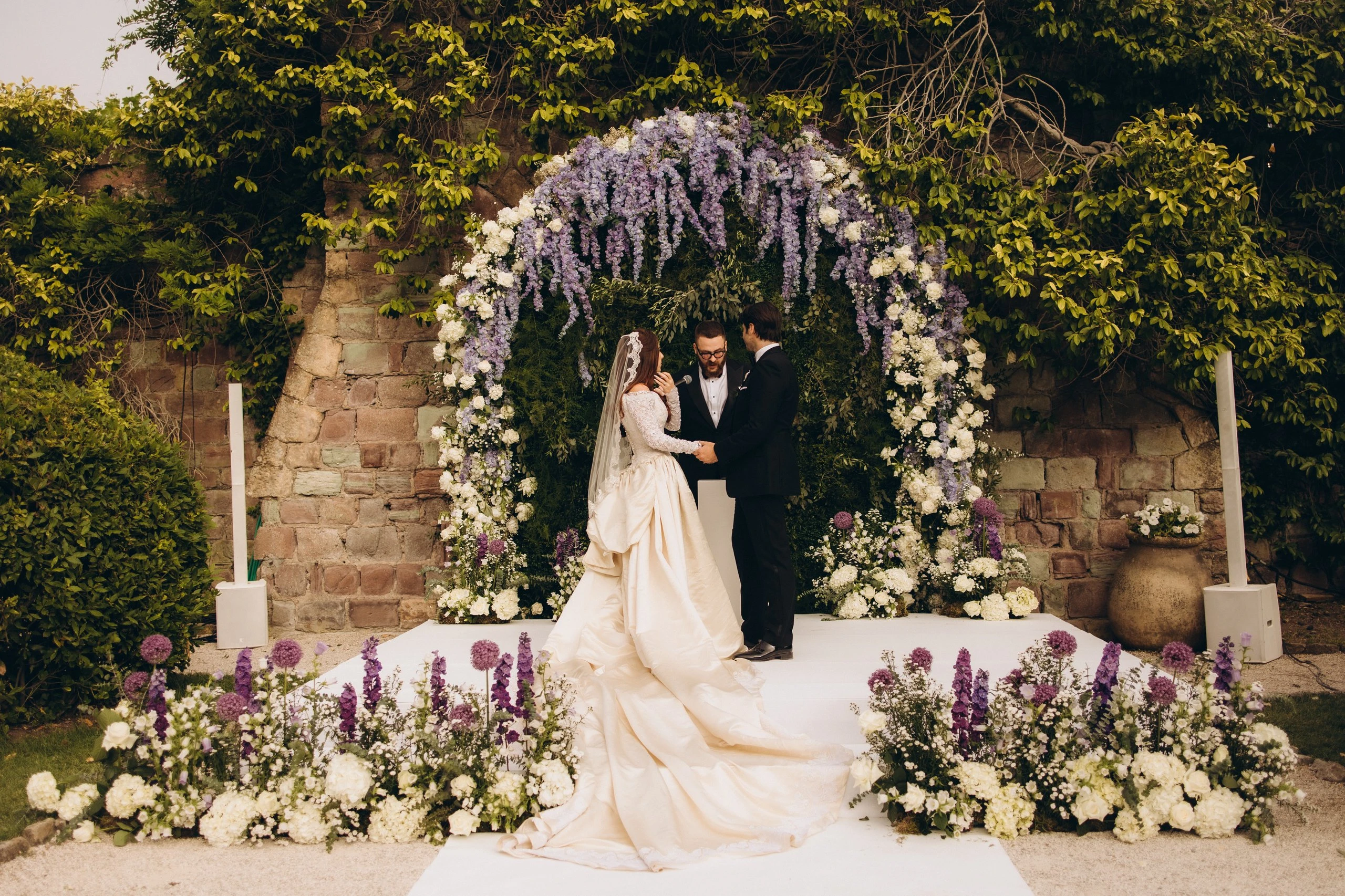 Ceremony under the wisteria arch