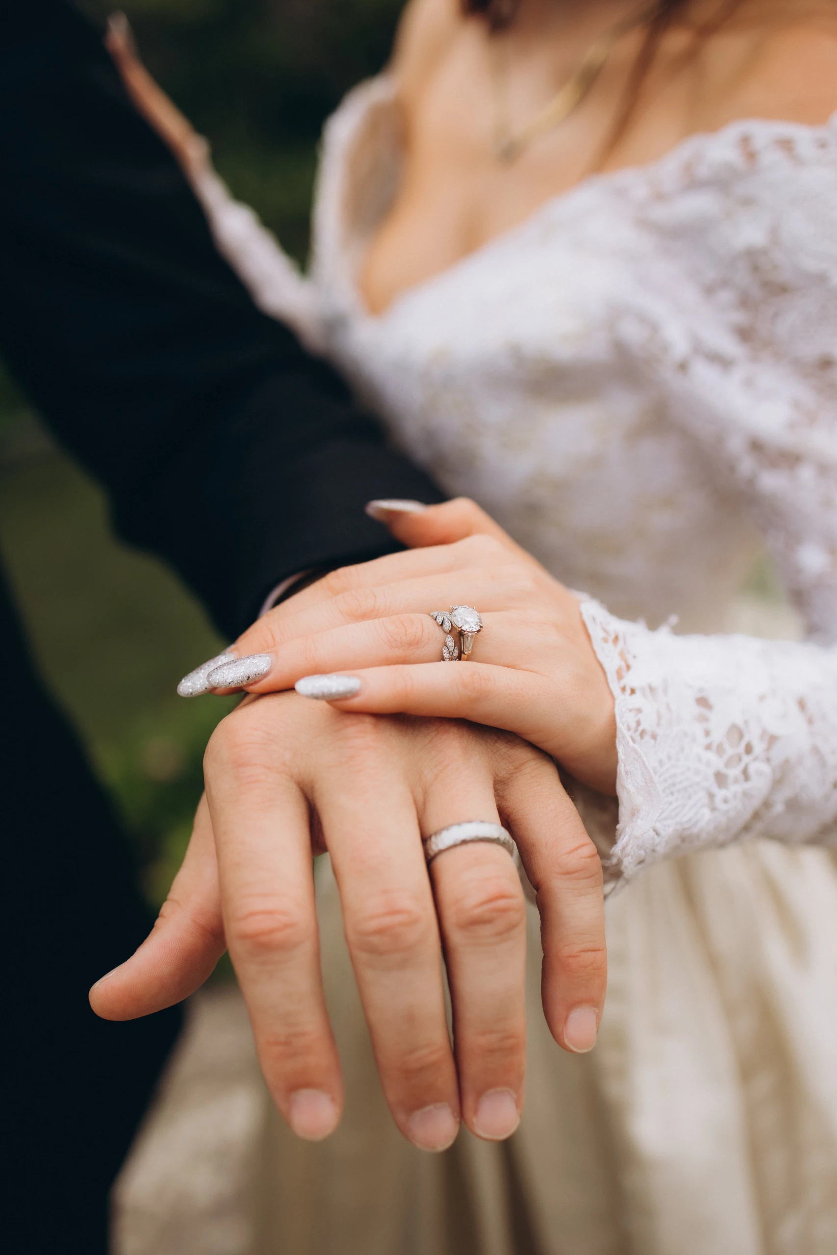 Wedding rings on the couple's hands