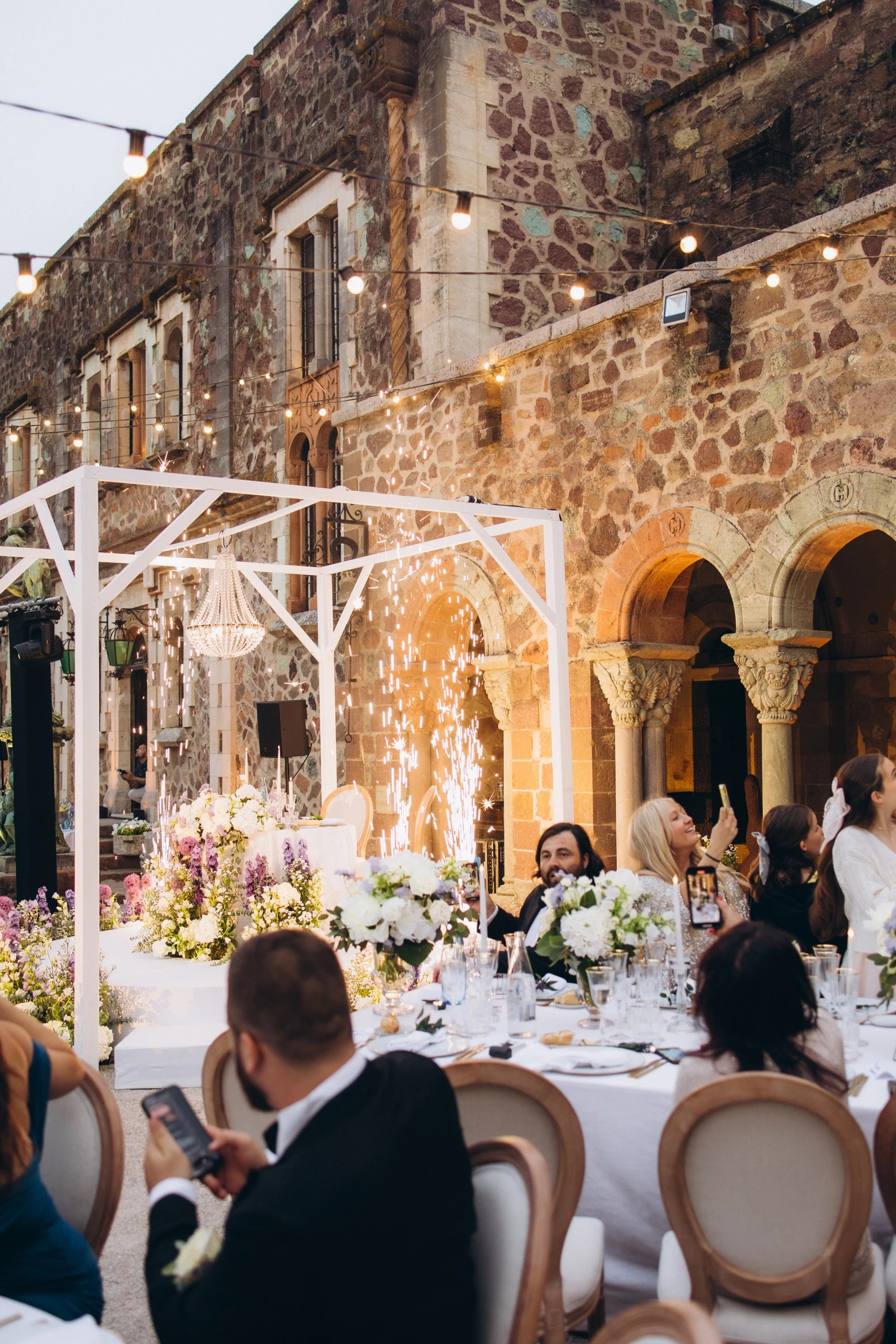 Dinner in the castle courtyard at dusk