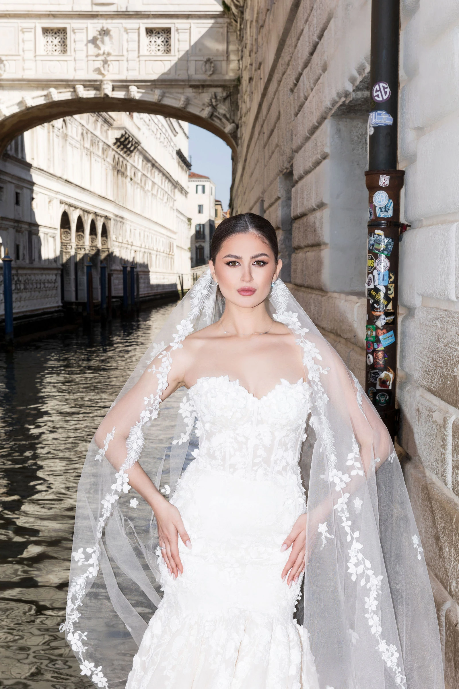 Bride by a canal bridge in Venice