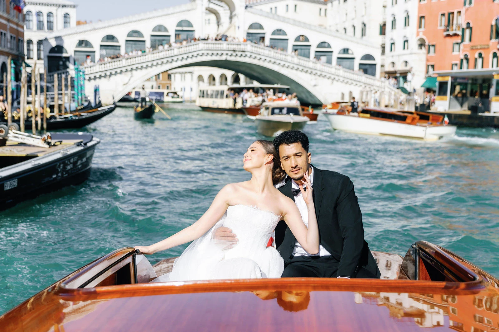 Water taxi passing the Rialto Bridge