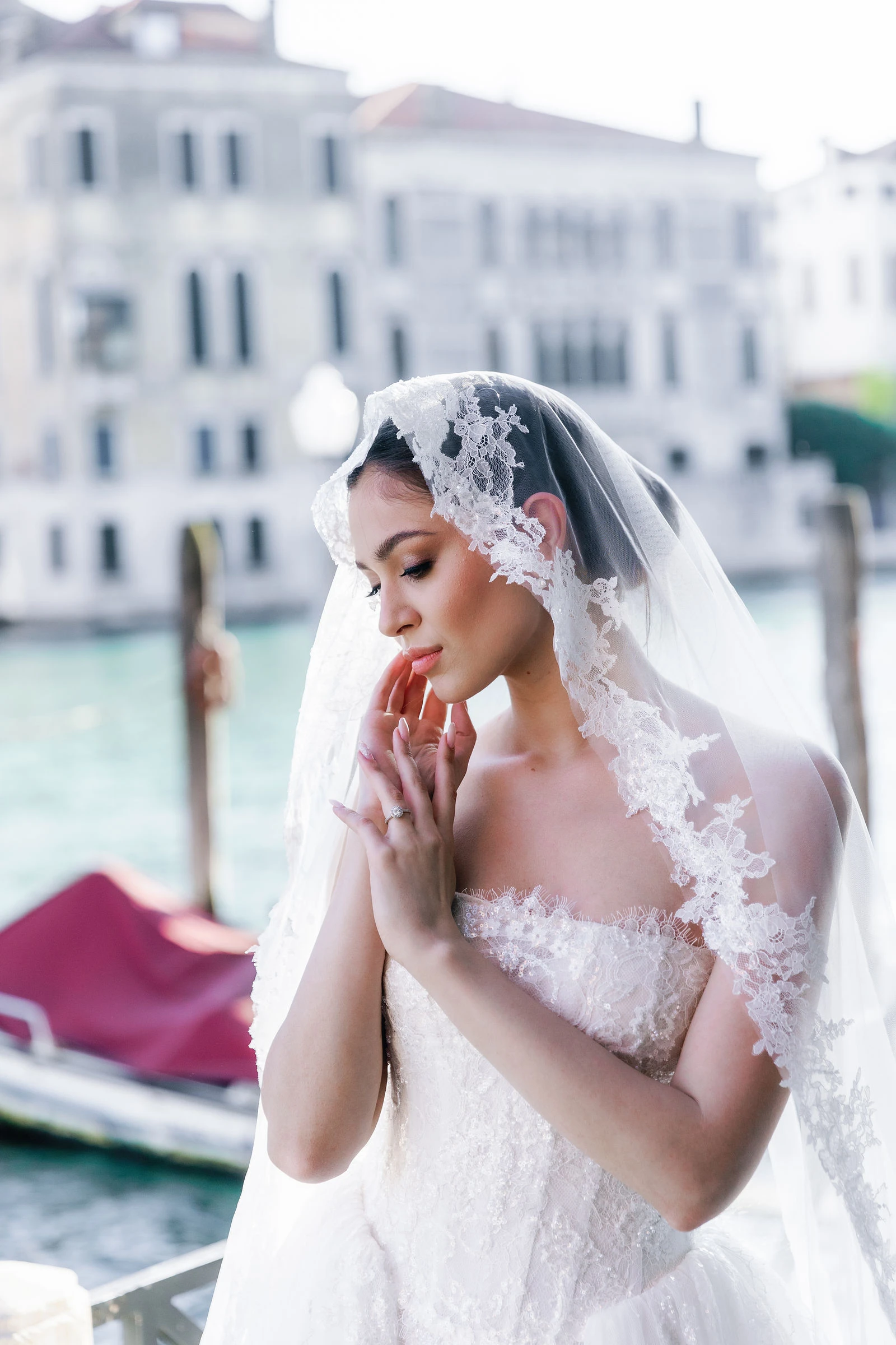 Bride in a lace veil on the Grand Canal